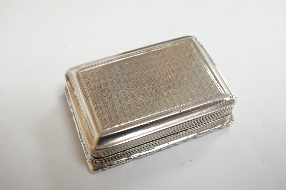A William IV engine turned silver rectangular vinaigrette, by William Simpson, Birmingham, 1830, the central cartouche engraved 'Remember Me', 42mm (grille detached).